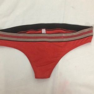 Victoria’s Secret red thong panties.  Sz L